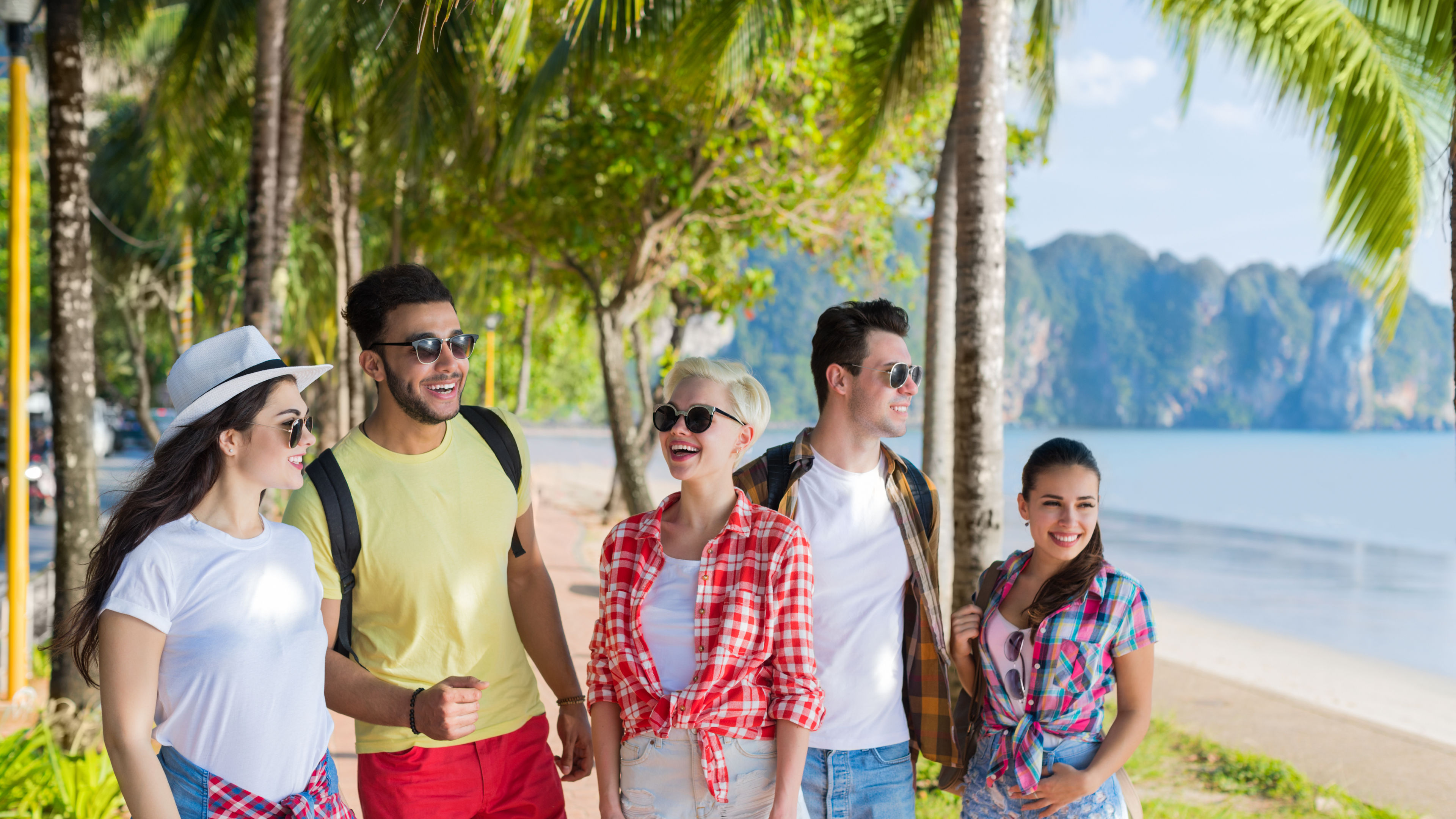 A group of young people enjoying their vacation happily. 
