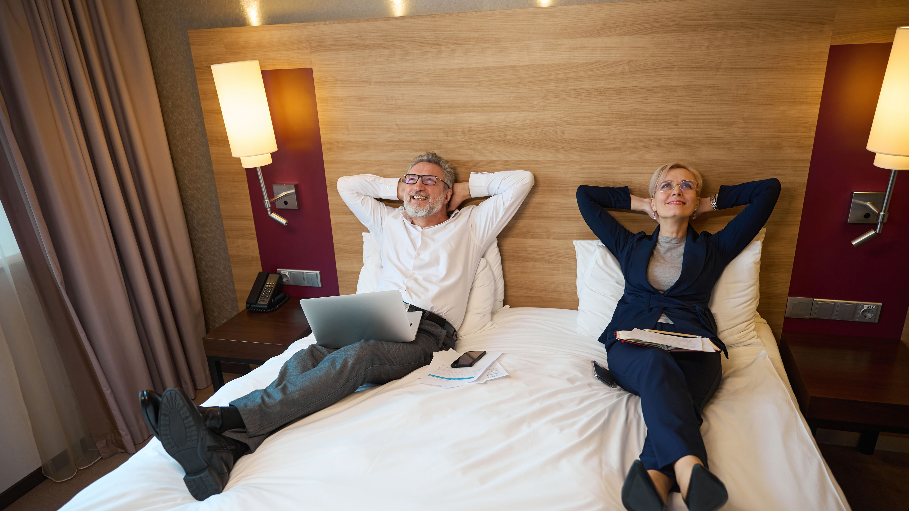 A young man and a happy woman enjoying hotel 