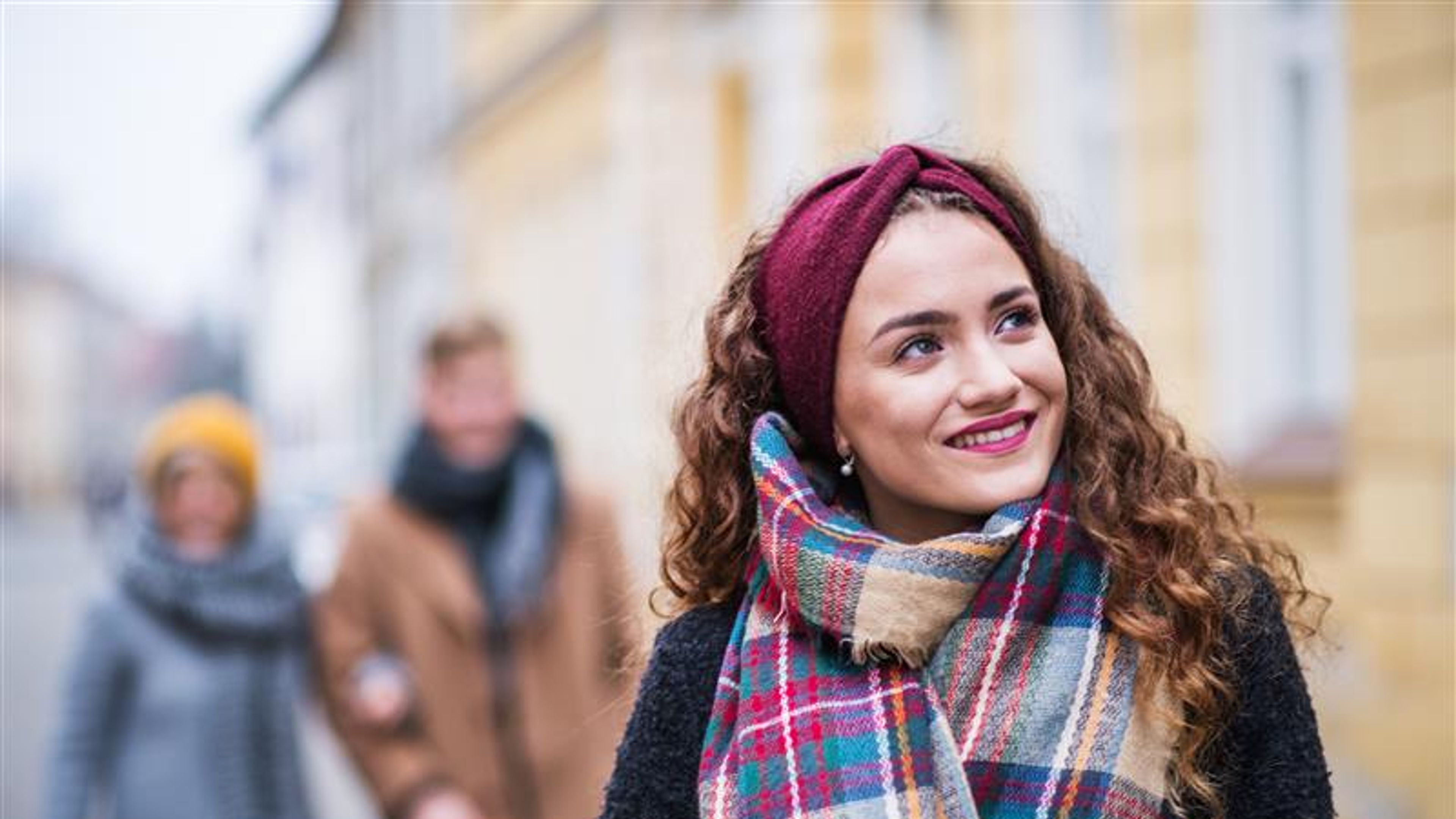 A portrait of teenage girl with headband and scarf