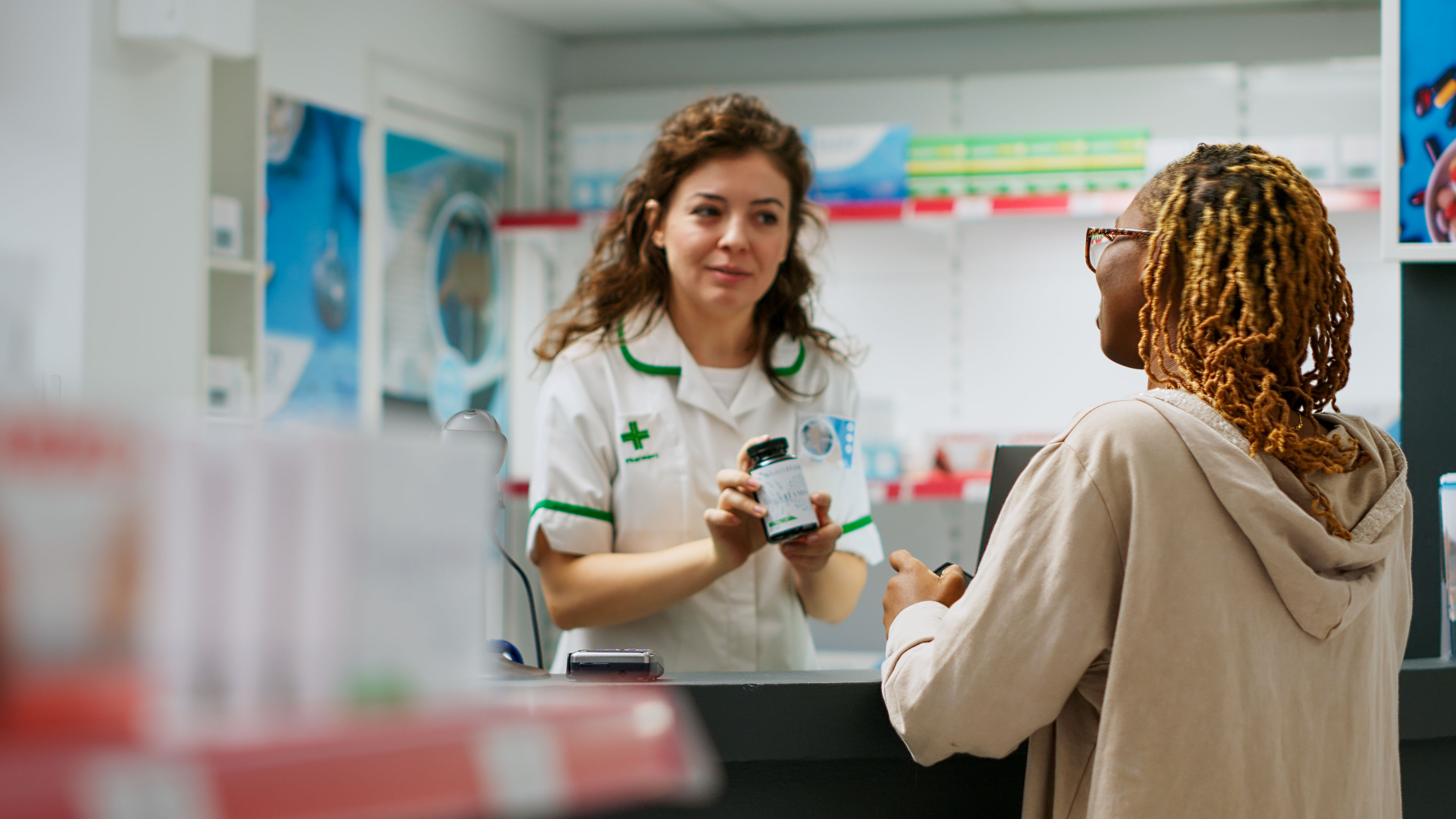 African american person asking pharmacist about prescription treatment 