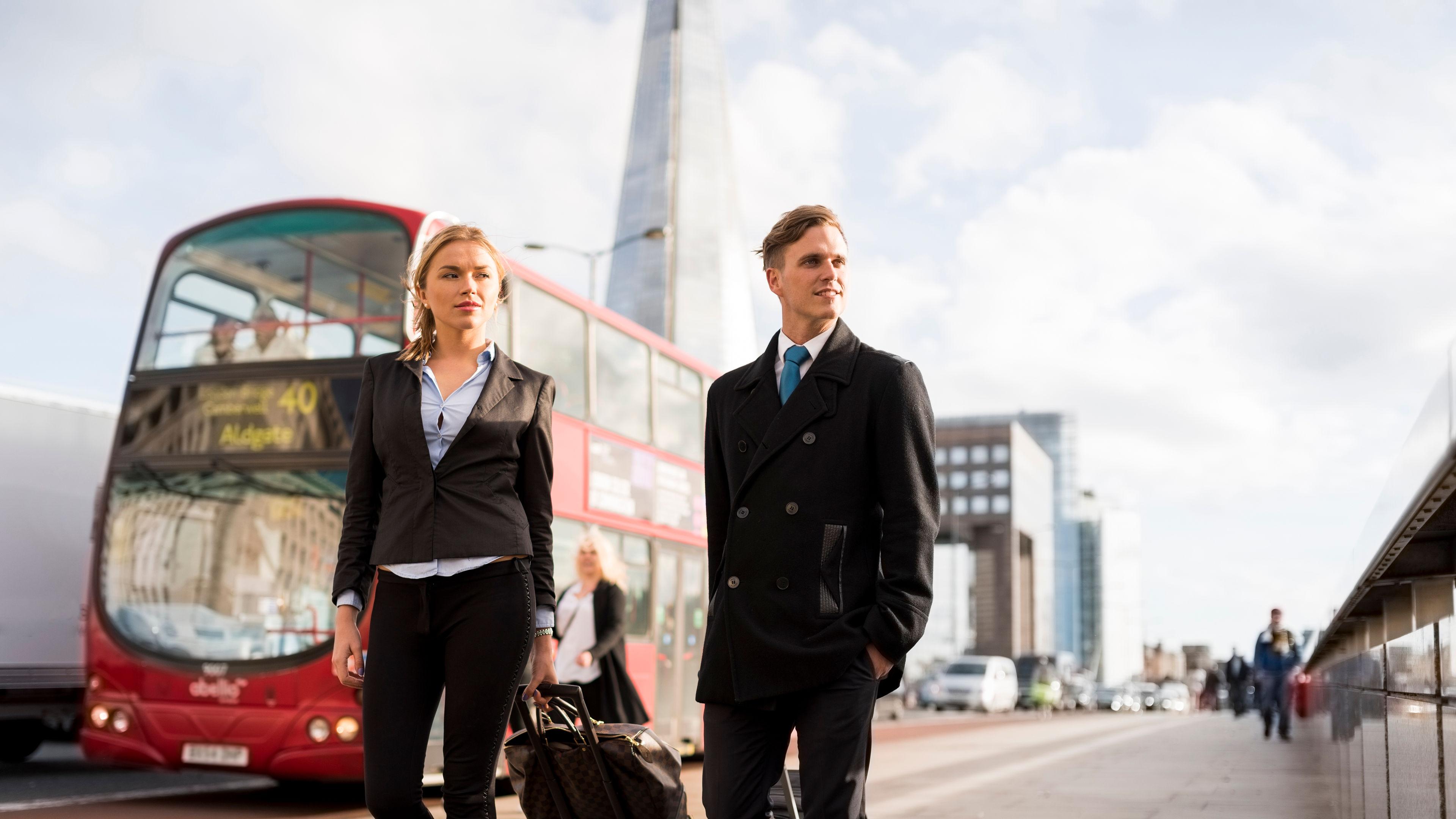 Businessman and businesswoman on business trip, London, UK 