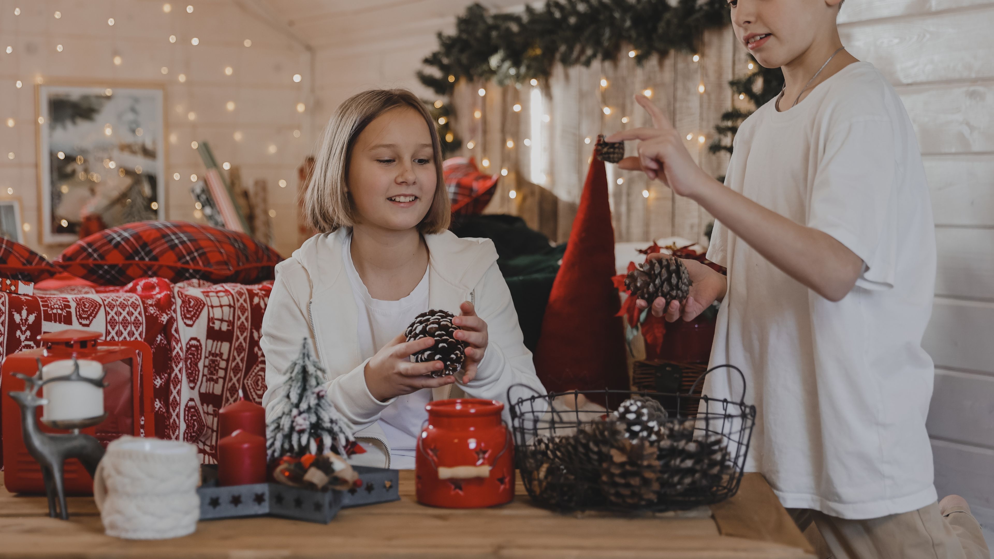 A cosy New Year celebration at home by a cheerful couple, surrounded by festive decor 