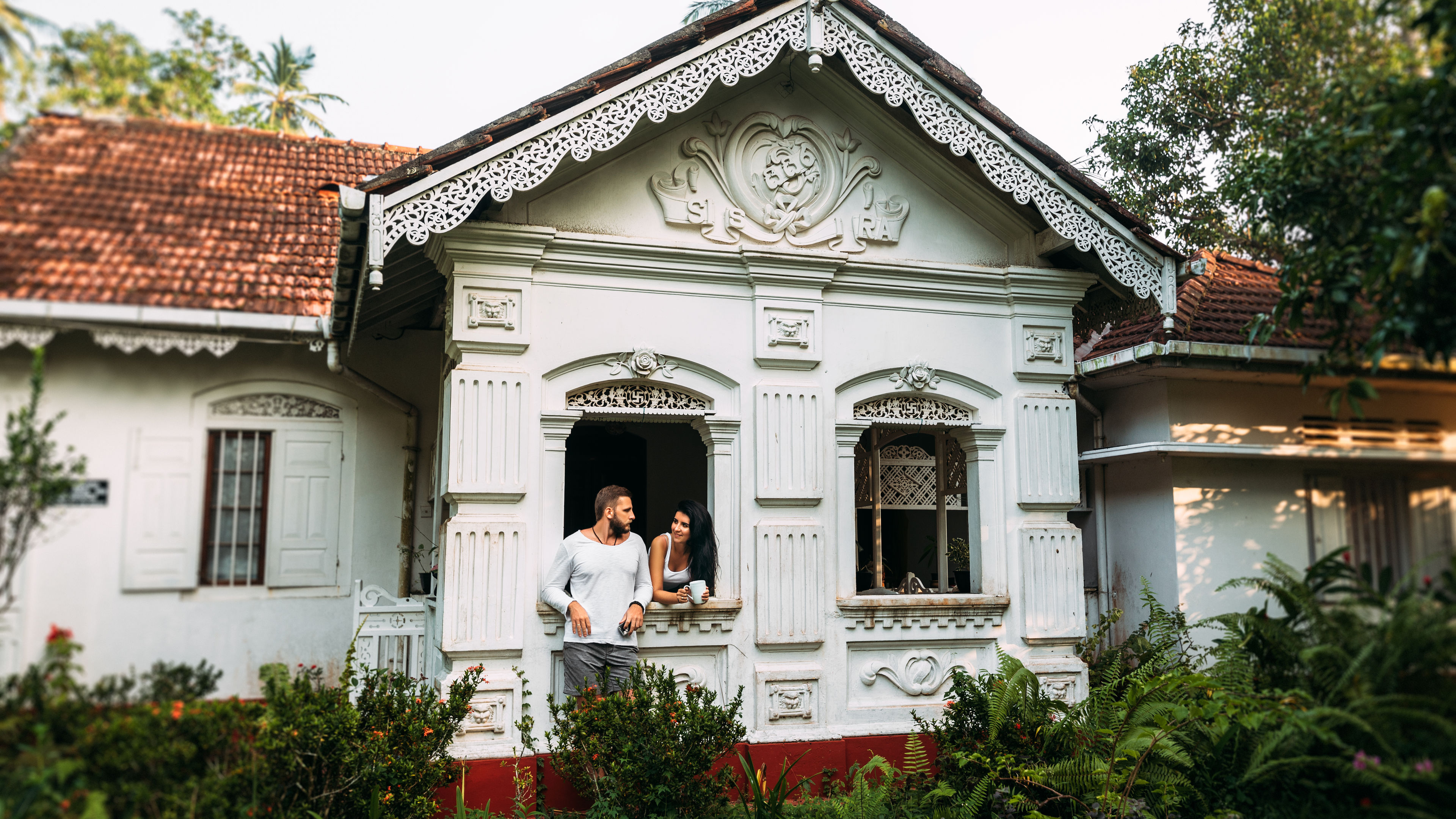 Couple enjoying tea at a historic guesthouse