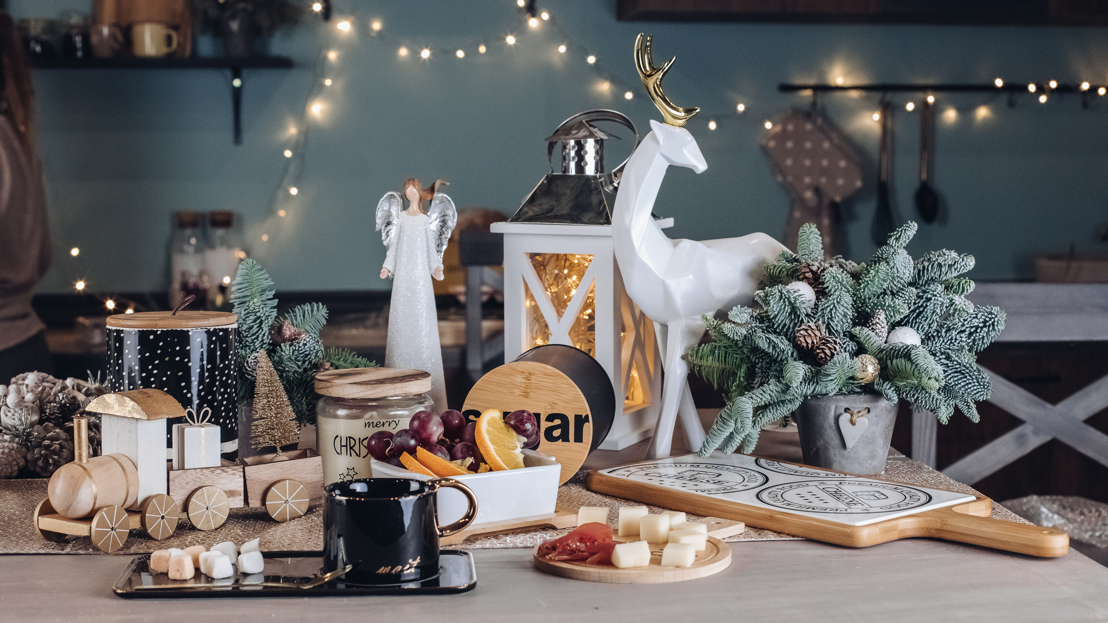 A cup on a festive table with decorative pieces. 