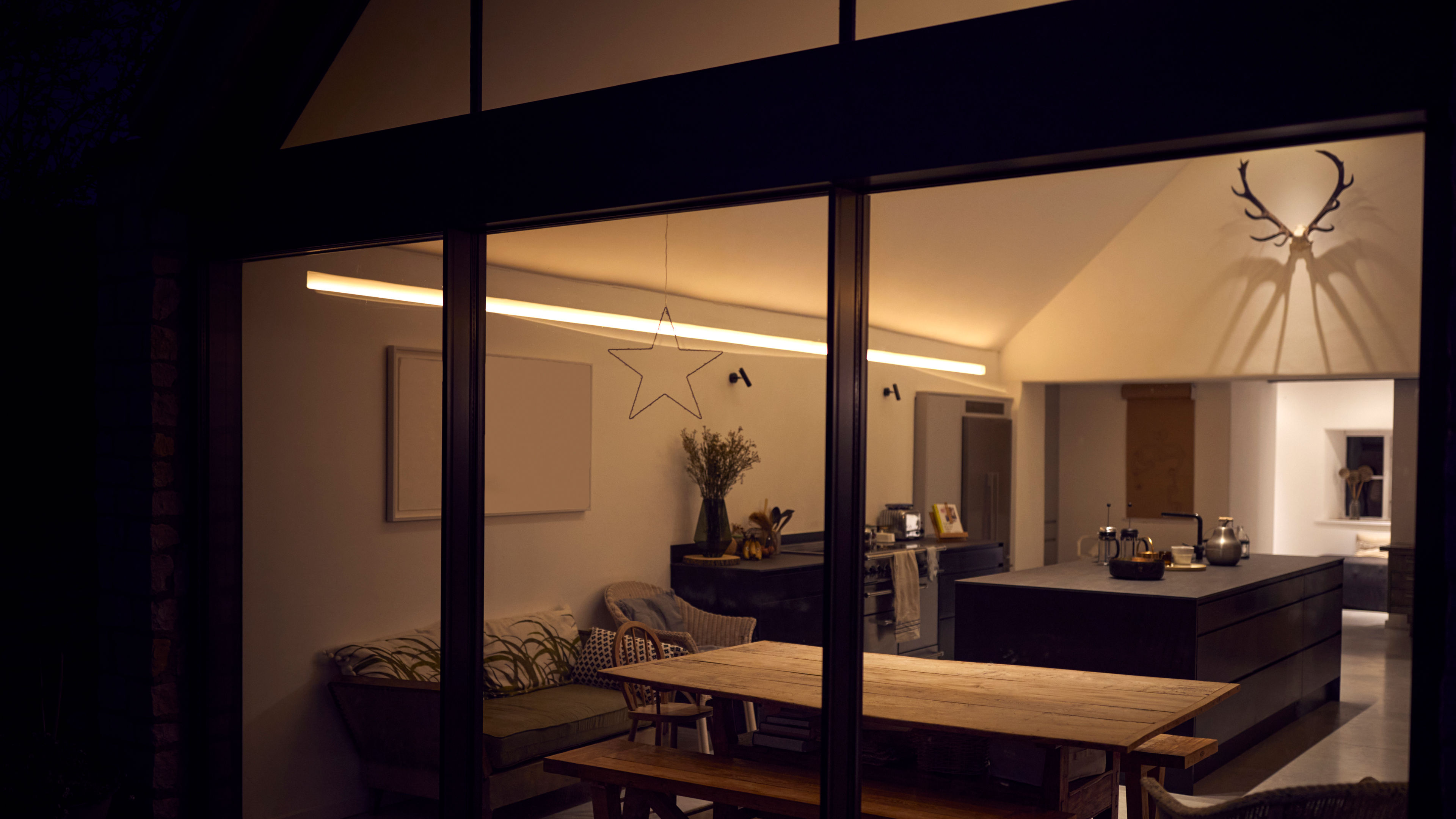 An exterior view of a beautiful kitchen and its light settings 
