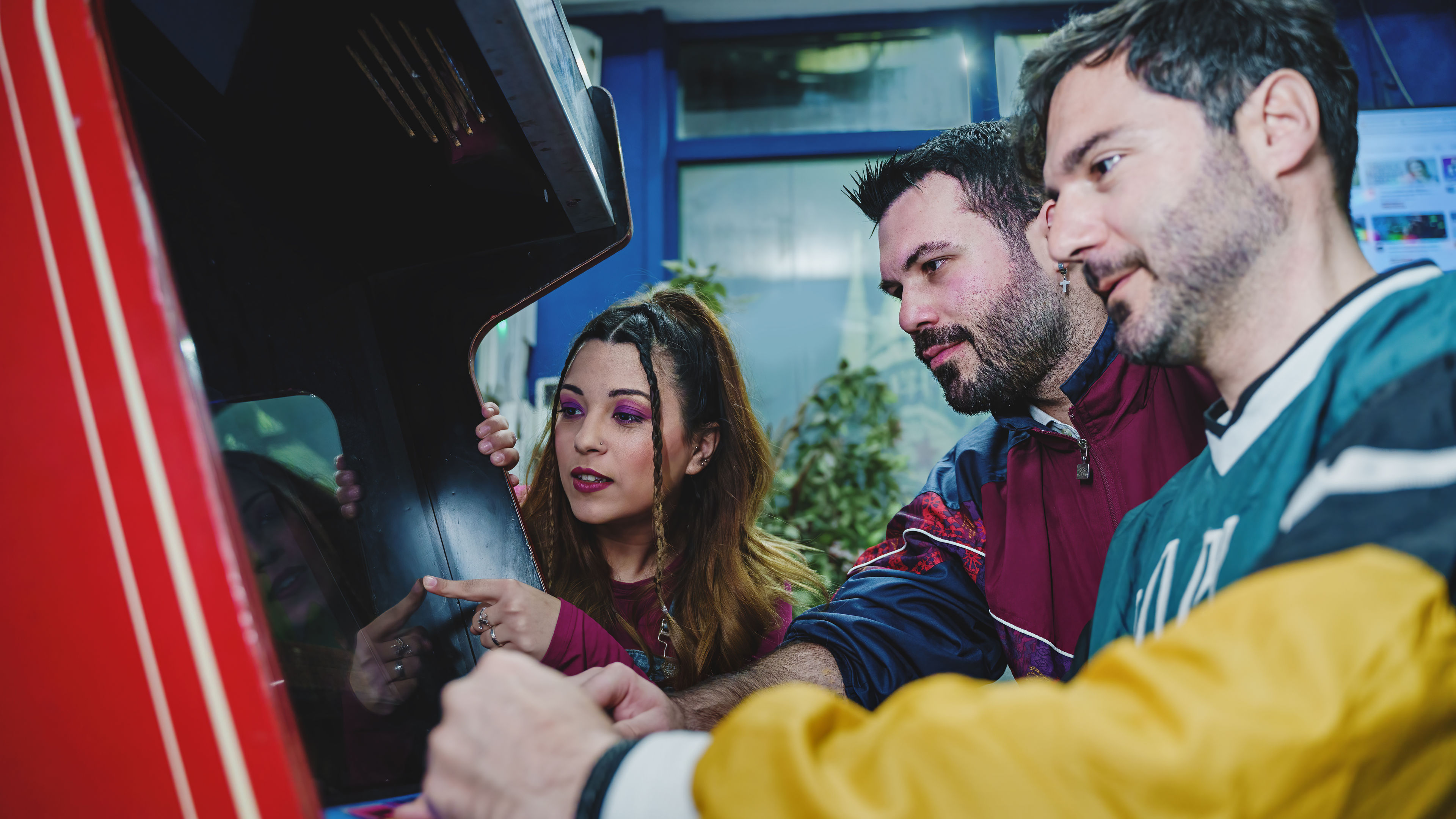 Friends Enjoying Retro Arcade Game. 