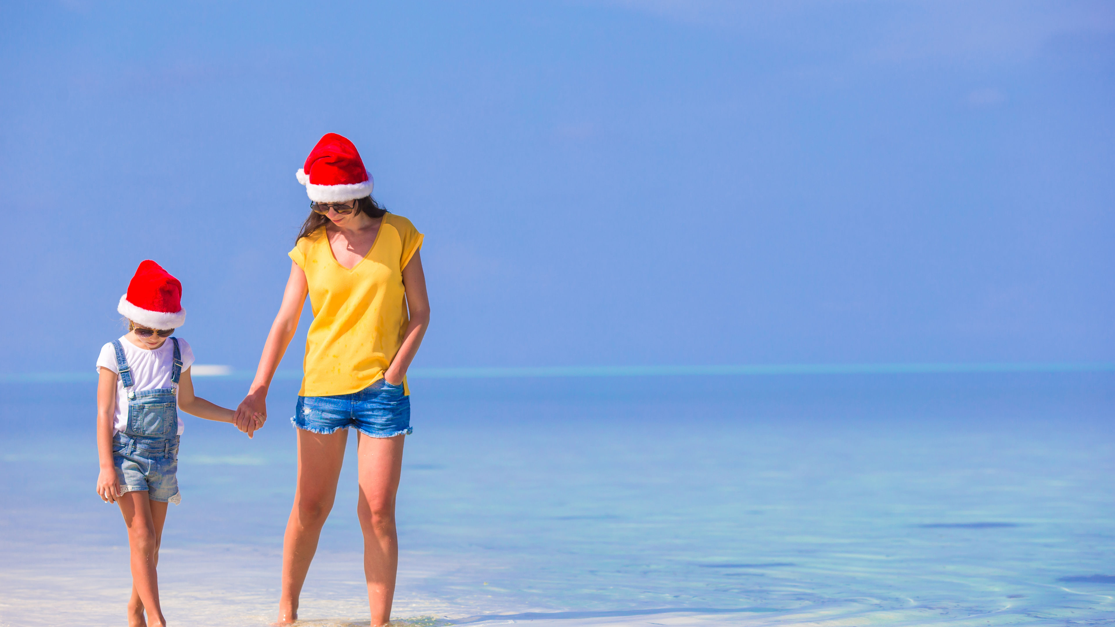 Happy mom and daughter in beach. 