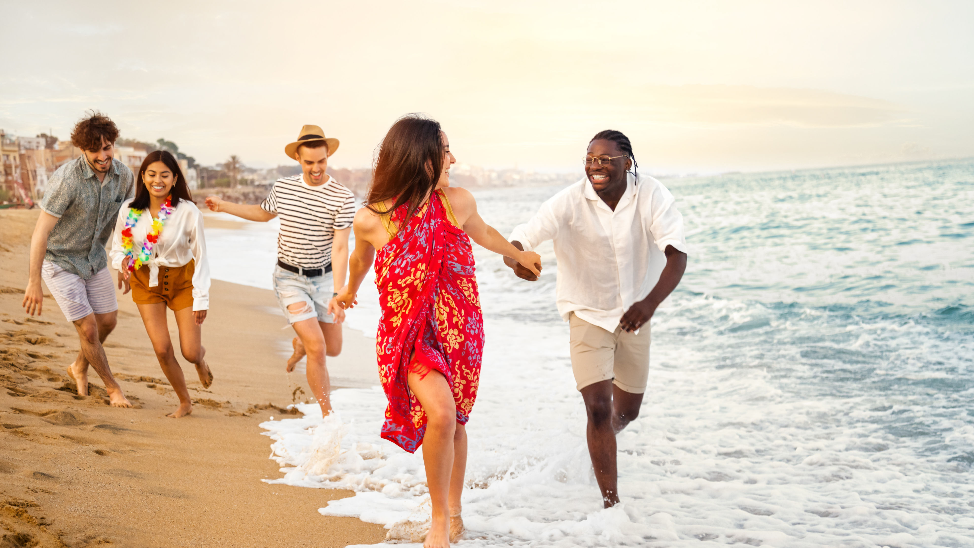 Image of People running on beach and enjoying 