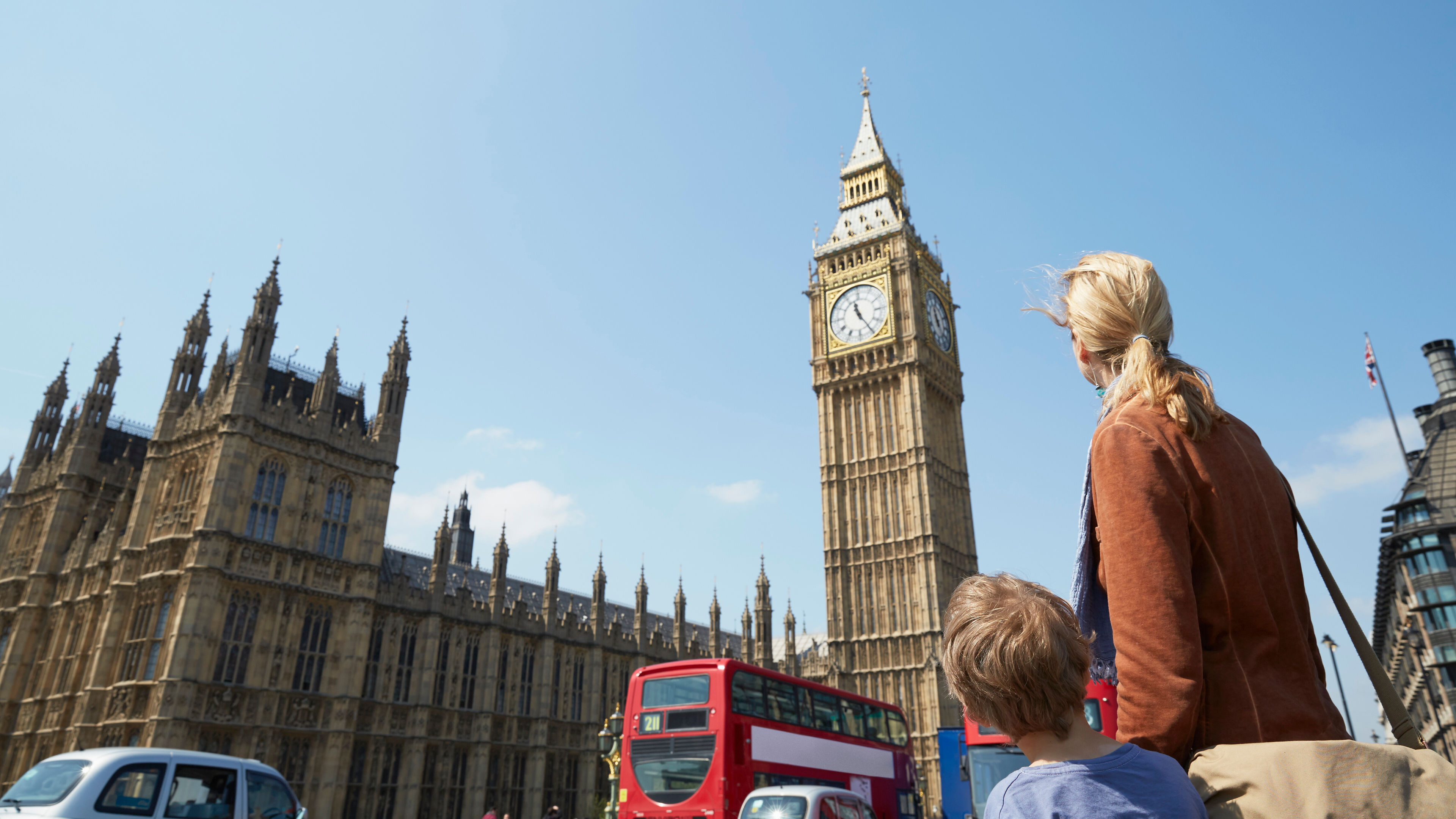 Rear view of mother and son looking at big ben 