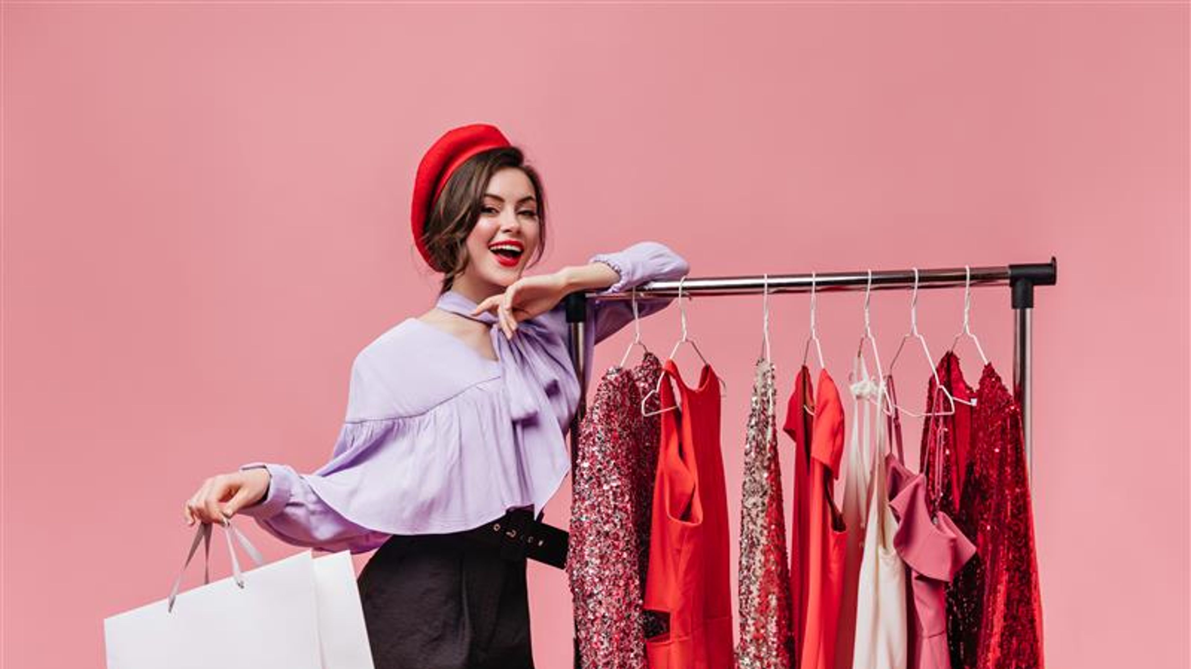 Smiling woman leans on the rack 
