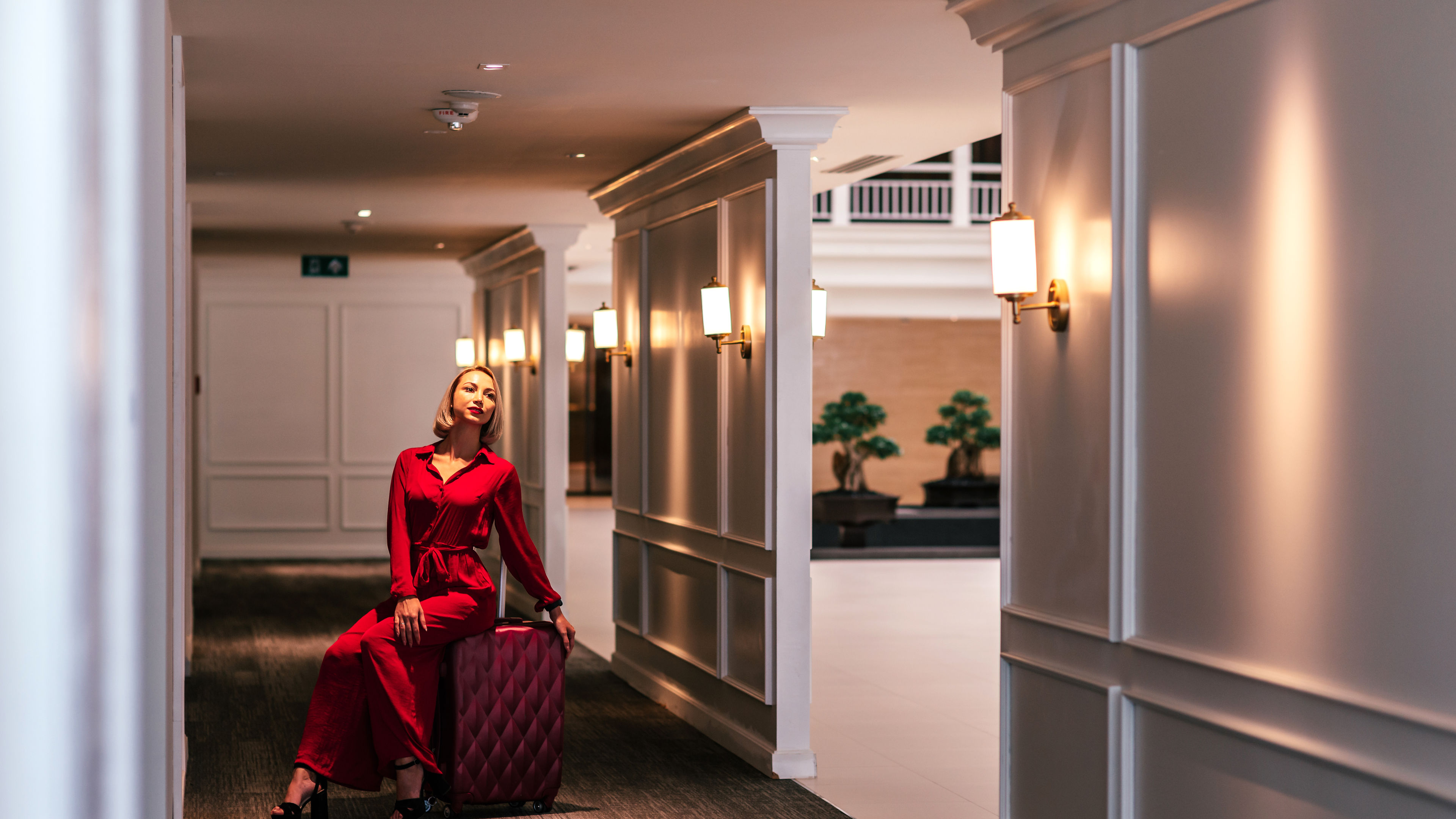  Think beyond expectation. Attractive businesswoman arriving at hotel. 