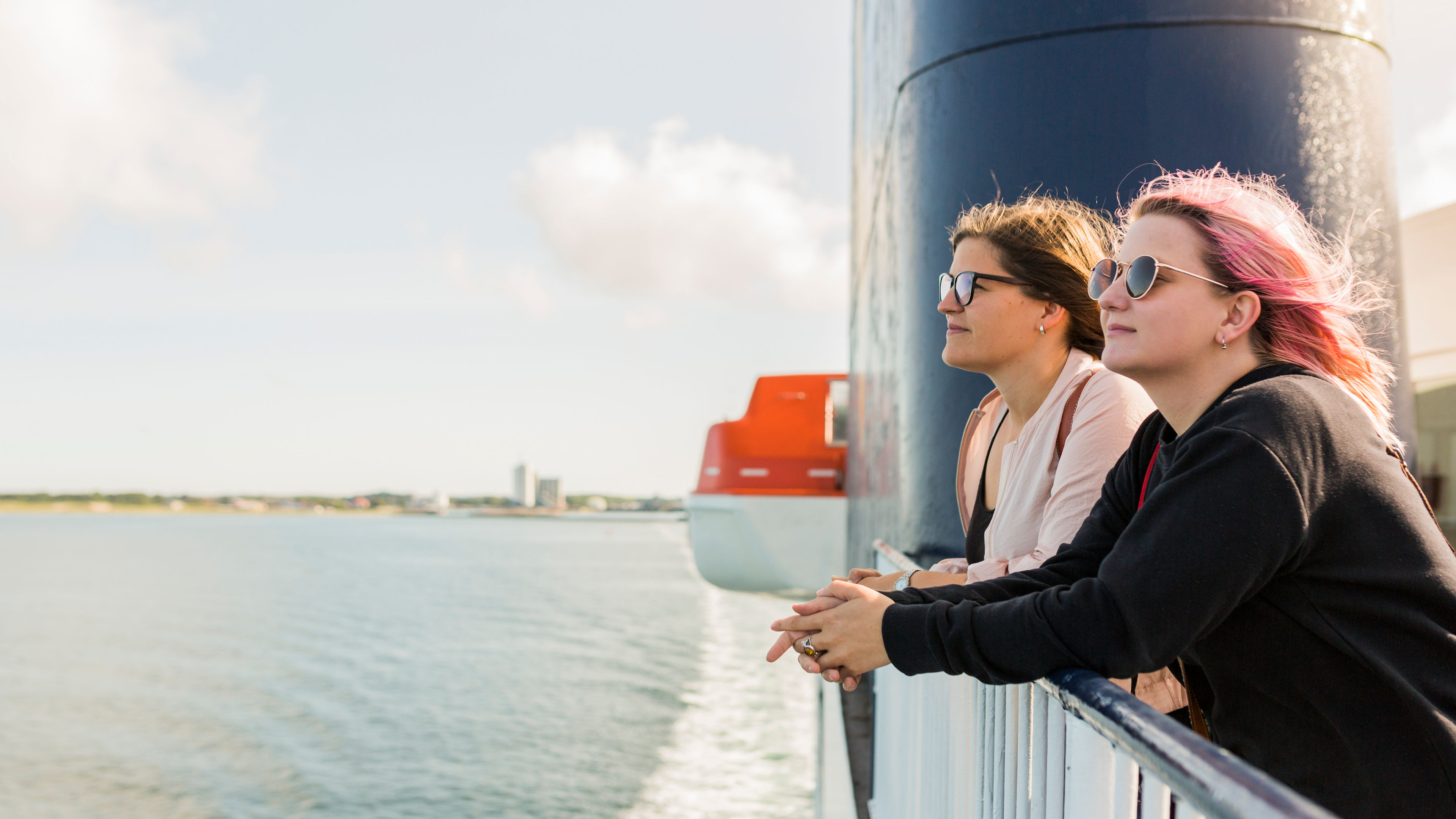 Two women enjoying ferry travel