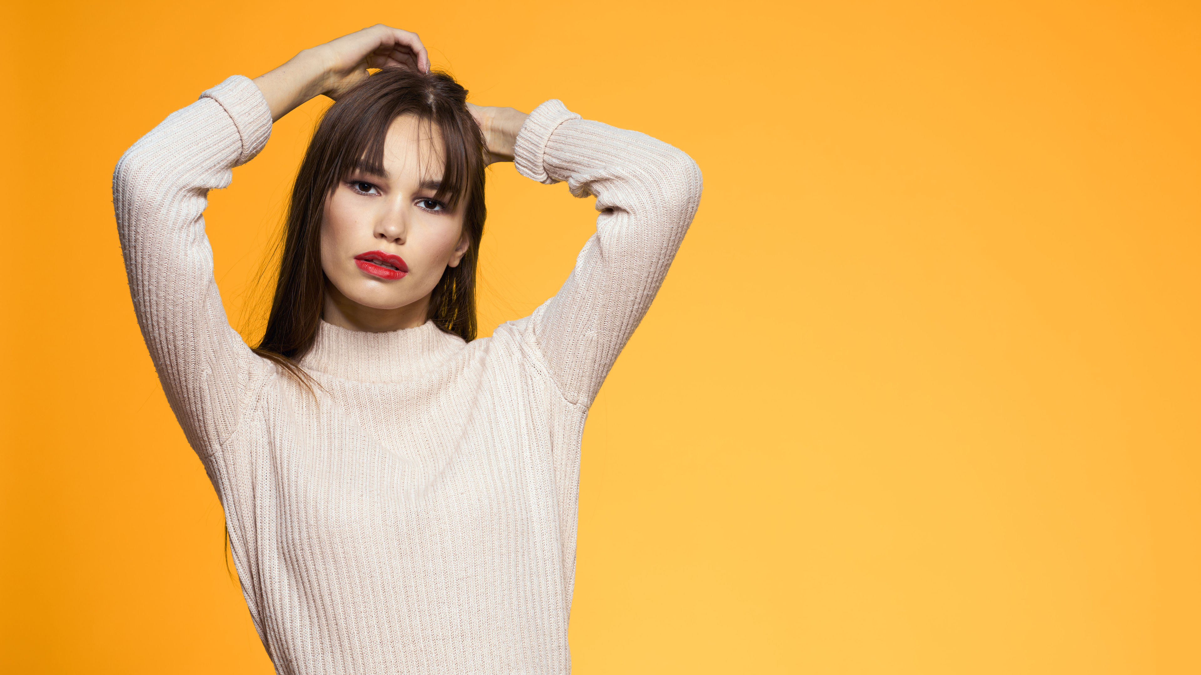 Fashionable Woman posing in long sleeve top 