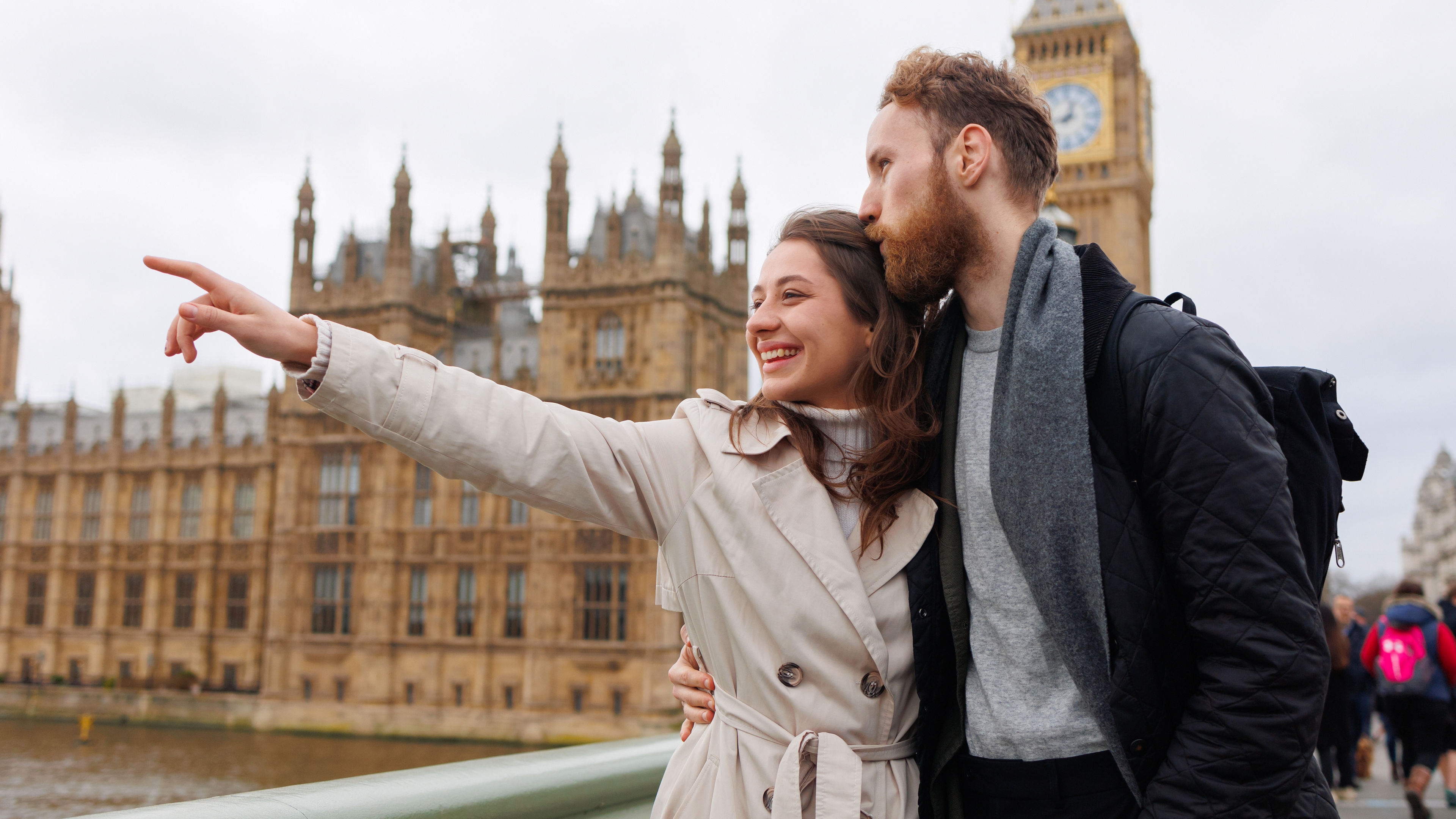 A young couple strolls through London, mesmerised by its iconic landmarks 